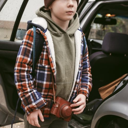 child-outdoors-with-car-road-trip