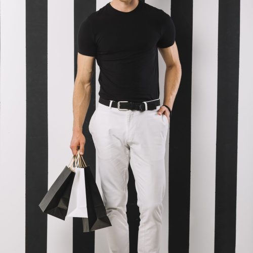 handsome-adult-man-holding-shopping-bags